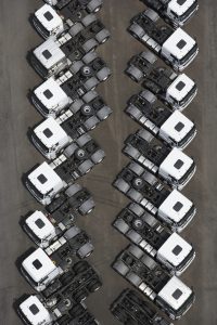 Flatbed trucks in parking lot2