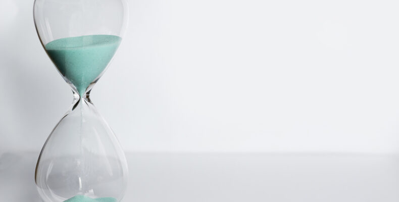 A hourglass with blue sand representing the Abolition of the EPO ‘Ten Day Rule’ from November 1, 2023