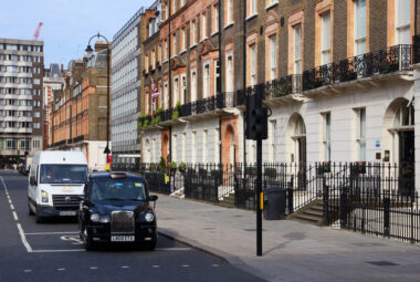 Black hackney cab in Russell Square, London, UK.